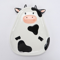 Adorable pot de rangement en céramique en forme de vache avec des taches noires et un nez rose pour ranger des biscuits, des bonbons ou de petits articles de cuisine
