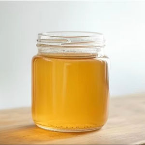 Miel de naranja natural dorada Calidad orgánica pura Aroma rico Cuerpo suave Ideal para cocinar alimentos diarios y comercio de exportación - Product Image 1