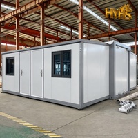 Casa Contenedor Expandible de Doble Ala de 20 Pies con Puerta Azul, Panel Sándwich, Moderna, Aislada, Impermeable, para Camping, Resort o Cochera
