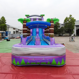 Structure gonflable géante pour enfants, thème tropical, avec toboggan aquatique double piste et piscine. - Product Image 6