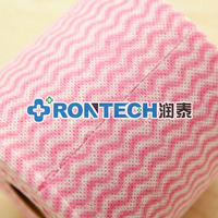 Machine à rouler et à découper les lingettes sèches en coton non tissé jetables pour cosmétiques