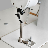 Machine à coudre à bras pour la fabrication de gants et petits articles textiles