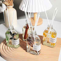 Nouvel ensemble diffuseur de parfum d'ambiance de luxe en verre avec bâtonnets de fleurs séchées et huiles essentielles