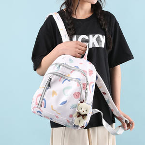 Mini mochila con estampado de dibujos animados para mujeres y niñas, ligera, impermeable, de tela Oxford, bolsa de viaje escolar con bolsillos delanteros con cremallera - Product Image 1