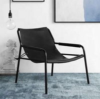 Fauteuil lounge en cuir pleine fleur tanné végétal, design danois moderne, pour projet hôtelier 5 étoiles, idéal pour salon.