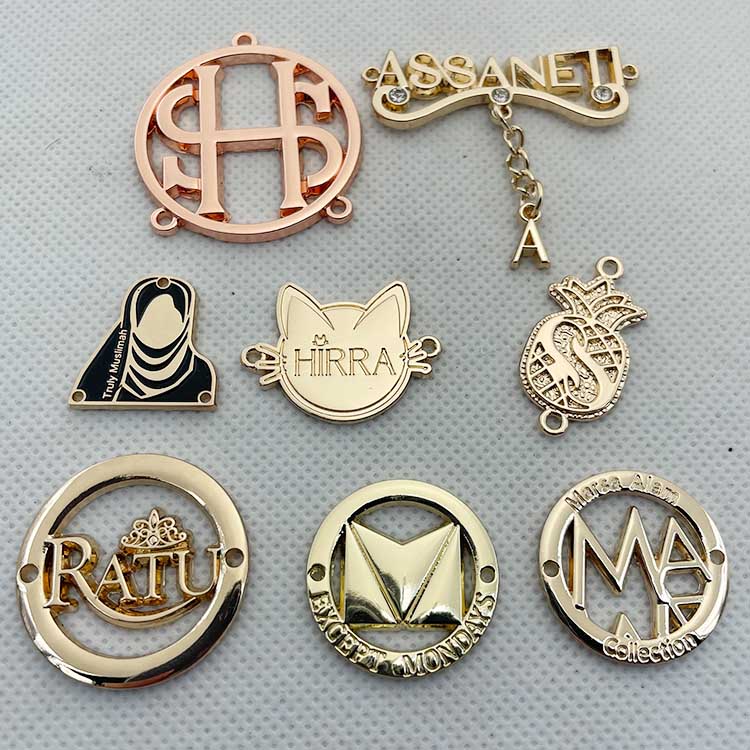 Neostar Zinc Alloy Custom Clothing Brand Logo Engraved Gold Metal Tag Labels For Garment / Swimwear