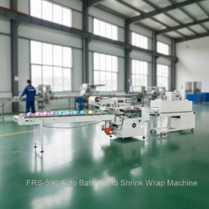 Machine d'emballage automatique électrique pour bombes de bain sous film rétractable, haute capacité 12000+ PCS/H, certifiée CE, pour produits de bain - Product Image 1