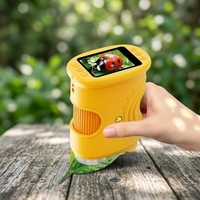 Loupe numérique portable pour l'exploration en plein air pour enfants, avec écran HD de 2 pouces et design compact.