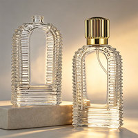 Flacon pulvérisateur de parfum rond en verre transparent de luxe personnalisé 50 100 ml