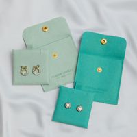Pochette d'emballage pour bijoux en microfibre en gros avec logo et couleur personnalisés pour les marques de bijoux en marque blanche