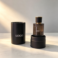 Vente en gros de flacons de parfum en verre vides personnalisés de 100 ml, avec pulvérisateur à pompe côtelé, bouchon noir et or, cylindre, boîte cadeau avec marquage à chaud