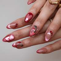 Ongles à presser en acrylique nude-rose, forme œil-de-chat, style français, avec paillettes, motif cœur cerise, forme amande, accent strass rouge, pour occasions estivales et fêtes.