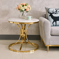 Table basse ronde personnalisée en marbre et pierre frittée avec piètement en acier inoxydable pour hôtel, villa, appartement, café