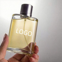 Parfum 100ml Eau de Parfum, flacon en verre rectangulaire, liquide ambré, bouchon argenté, logo personnalisé, parfum unisexe pour homme parfait