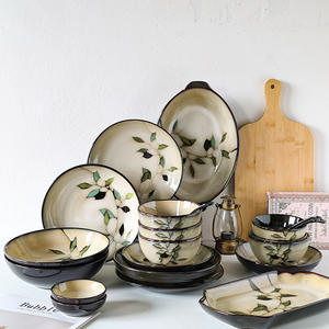 Vente flash : Ensemble de vaisselle en céramique grise émaillée flamboyante, bols et assiettes à riz créatifs de style japonais en porcelaine fine, dessinés à la main - Product Image 1