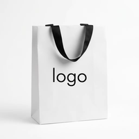 Sacs d'emballage en papier blanc et noir en gros, sacs cadeaux en papier blanc personnalisés avec logo imprimé, sacs en papier de luxe avec poignées
