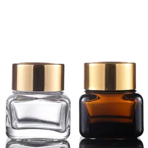 15g Luxury empty packaging OEM clear / amber cosmetic facial cream body lotion PET plastic jar containers with gold lid
