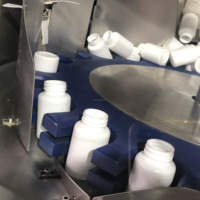 Désembrouilleur automatique de bouteilles pour ligne de production de comptage et d'emballage de capsules de comprimés