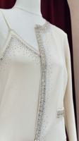 Ensemble deux pièces en tissu tricoté effet diamant, comprenant une veste à manches longues, une camisole et une jupe longue. Faible MOQ 2 pièces.