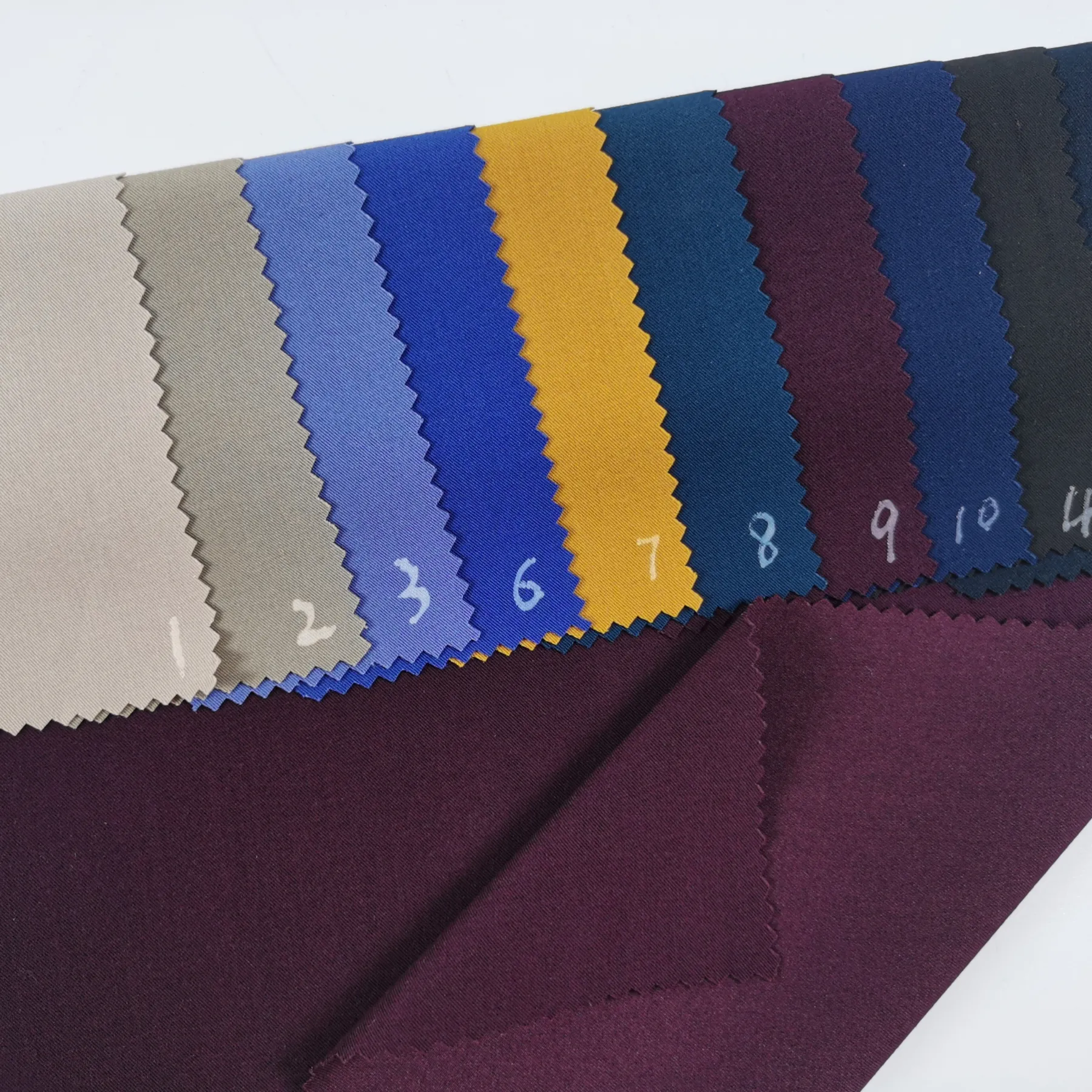 Penjualan terlaris kain tenun spandeks poly rayon TR kain solid untuk setelan, seragam dan celana