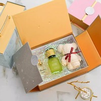 Boîte cadeau de luxe en carton à double porte avec bouteille de parfum, doublure en éponge et fermeture magnétique, vente en gros d'usine
