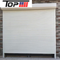 Porte à enroulement isolée en aluminium avec rupture de pont thermique pour économie d'énergie, idéale pour garage et atelier