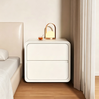 Table de chevet minimaliste moderne avec glissières silencieuses, coins arrondis et design compact pour le rangement de la chambre à coucher
