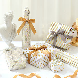 Venta al por mayor de alta calidad 80g 43*300cm papel de embalaje de estampado en caliente papel de regalo - Product Image 1