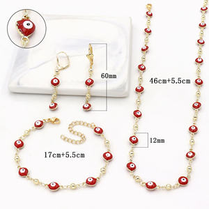 Parure de bijoux trois pièces plaqué or 14 carats avec zircon, motifs gouttes d'huile, yeux bleus et rouges, et cœur, pour femme - Product Image 1