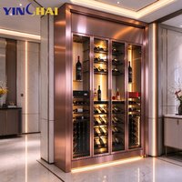 Armoire à vin isotherme personnalisée en acier inoxydable or rose avec dessus sculpté ajouré et porte vitrée
