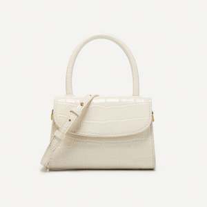 กระเป๋าแฟชั่นผู้หญิงแบรนด์หรู หนัง PU ปี 2025  แบบลำลอง ปิดด้วยกระดุม ความจุ 1-1.9 ลิตร - Product Image 2