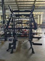 Machine Smith multifonctionnelle Équipement commercial de fitness et de gymnastique Squat Rack Power avec pile de poids en acier