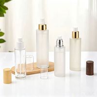 Flacon pompe à lotion rond en verre givré transparent de 60 ml, 80 ml, 100 ml avec bouchon supérieur noir, or, argent, logo personnalisé, utilisation cosmétique