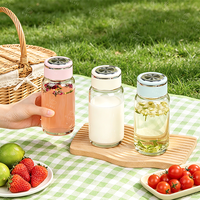 Bouteille d'eau sport en verre transparent écologique personnalisée, prix de gros, avec couvercle à vis et poignée, pour usage extérieur