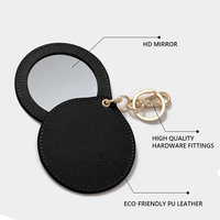 Miroir de poche rond en gros avec porte-clés, couvercle en cuir végétalien pivotant, logo personnalisé, marque privée, mini miroir portable pour sac