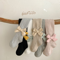 Vente en gros de leggings ras du cou pour enfants combinaison avec nœud de couleur unie et motif papillon printemps automne chaussettes pour bébés pour filles