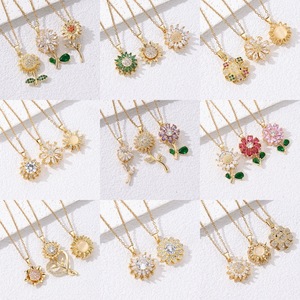 Collier transfrontalier de mode européenne et américaine pour femmes polyvalent fleur à trois pétales oeil de chat conception de pierre zircon rotatif - Product Image 1
