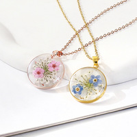 Bijoux de collier en acier inoxydable doré haut de gamme à la mode avec chaîne à maillons vraie fleur et pendentif en résine transparente de fleur séchée