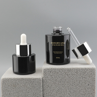 Bouteille de sérum noire avec logo personnalisé 20ml 50ml bouteille en verre cosmétique bouteille d'emballage de crème pour le visage flacon compte-gouttes emballage de soins de la peau