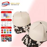 Gorras de Béisbol y Trucker Personalizadas 2026 XNKY OEM con Diseño de Camuflaje y Estampado de Vaca, Correa Ajustable, 5 o 6 Paneles, Cierre a Presión