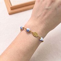 Bracelet chapelet en perles de porcelaine bleue et blanche avec croix en acier inoxydable, bijou religieux catholique vintage pour femmes