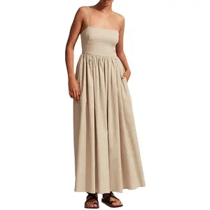 Women midi length dress with a fitted bodice fine straps voluminous skirt side pockets invisible back zip100%linen cami dress