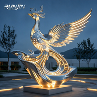 Sculpture d'art métallique Phénix lumineux en acier inoxydable poli miroir avec ailes LED, pour place de nuit, monument, statue, fabrication sur mesure