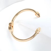 Bracelet jonc ouvert en alliage plaqué or de haute qualité pour femme, orné de strass et motif feuille, de Guangzhou