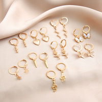 Nouvel ensemble de 9 boucles d'oreilles minimalistes de style européen en alliage plaqué or, avec étoile à cinq branches, papillon et cœur, et chaîne serpent