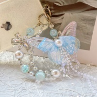 Chaîne de téléphone portable pour femme, chaîne de sac en perles, pendentif, fabrication artisanale de qualité, pompons fluides, porte-clés papillon double couche