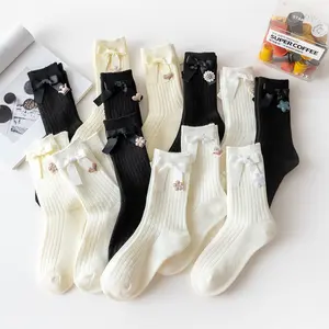 Custom logo korean JK socks for women cotton black plain fashion pearl bow kids and women sock