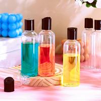 Vente en gros Bouteille en plastique transparente vide avec couvercle de presse noir adaptée au shampooing Lotion Crème pour le visage Récipient rechargeable