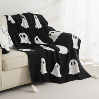 Couverture tricotée fantôme d'Halloween, couverture en tricot jacquard noir et blanc, douce et chaude avec des pompons blancs pour la chambre d'un adulte