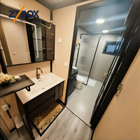 ZYBOX Vente directe usine Maison conteneur extensible préfabriquée en grain de bois de 20 pieds et 40 pieds, 2 chambres, modulaire, pliable, compacte, avec escalier, terrasse et porche